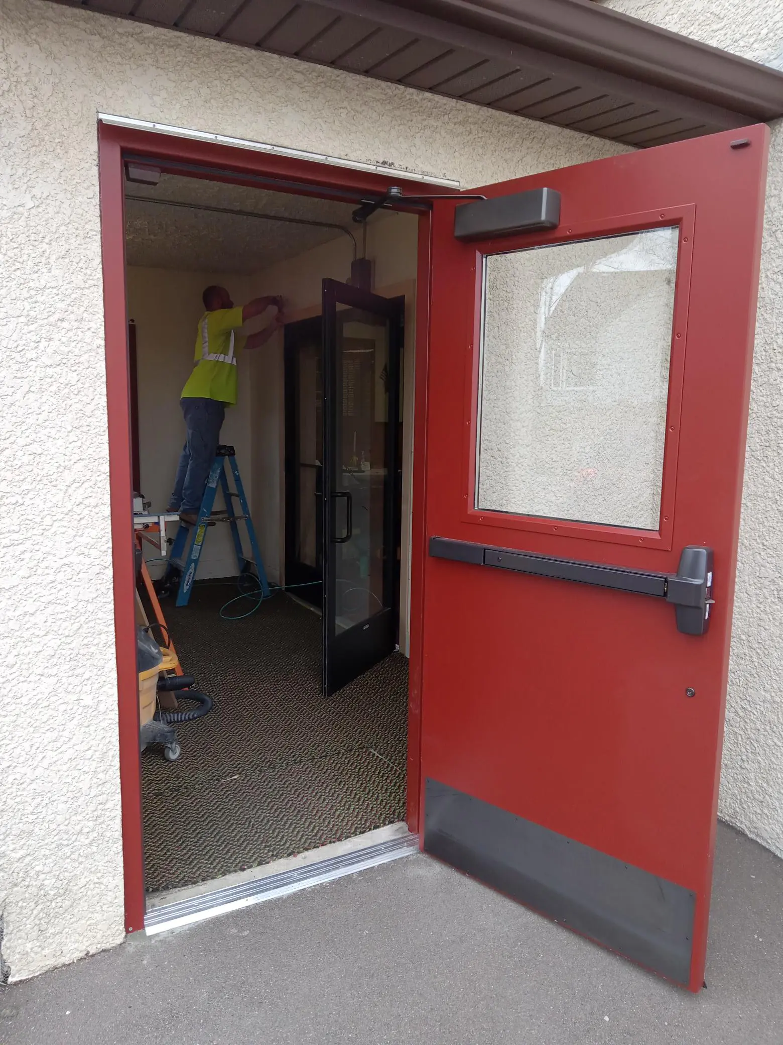 Versacon Employee repairing doors at the VFW